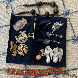 Assorted earrings, pins and necklaces.